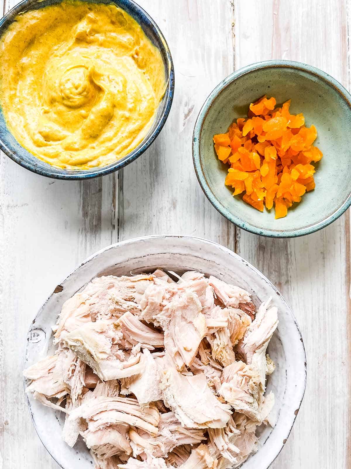 Three bowls of ingredients needed to make this easy turkey salad.